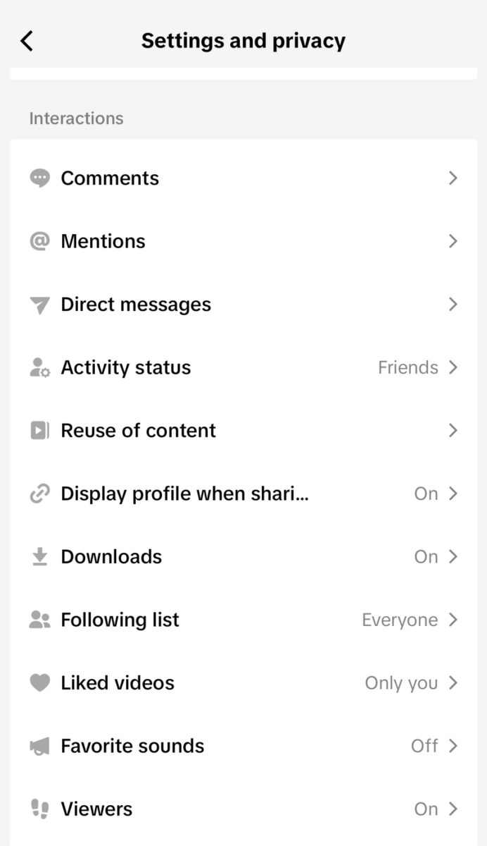 TikTok Settings and privacy screen showing the Interactions section, with Comments, Mentions, Direct messages, Activity status set to Friends, and Reuse of content listed fifth, followed by Display profile when sharing, Downloads, Following list, Liked videos, Favorite sounds, and Viewers.
